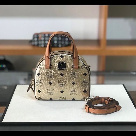 MCM Handbags - Last one! MCM gold color mini crossbody bag $780+ tax